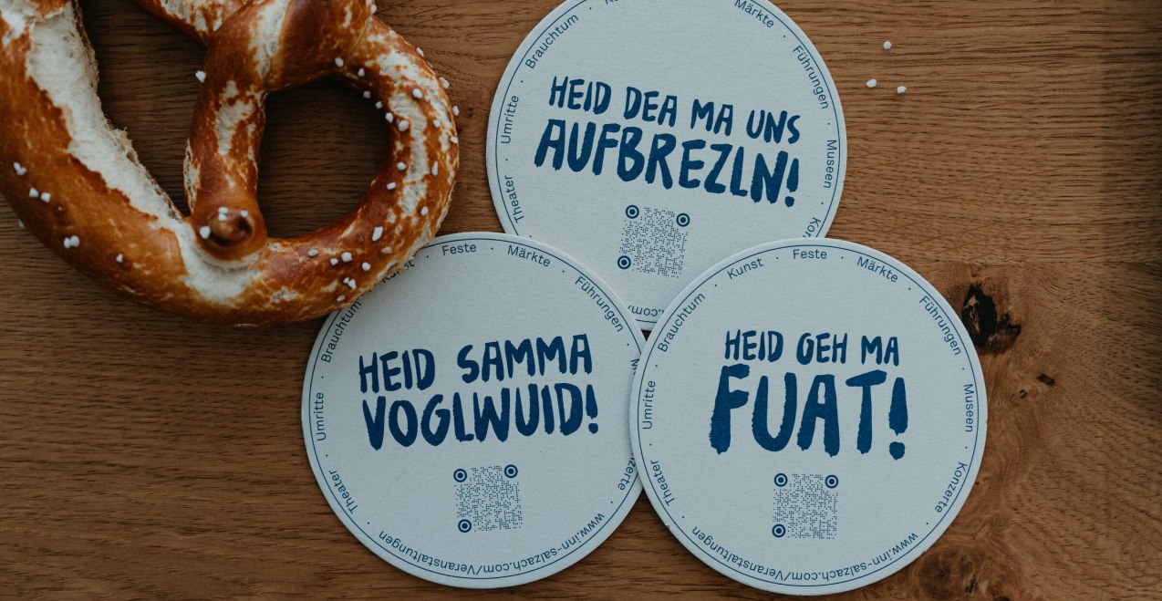 Bierdeckel mit bayerischem Spruch „Aufbrezeln&quot;, © Inn-Salzach Tourismus